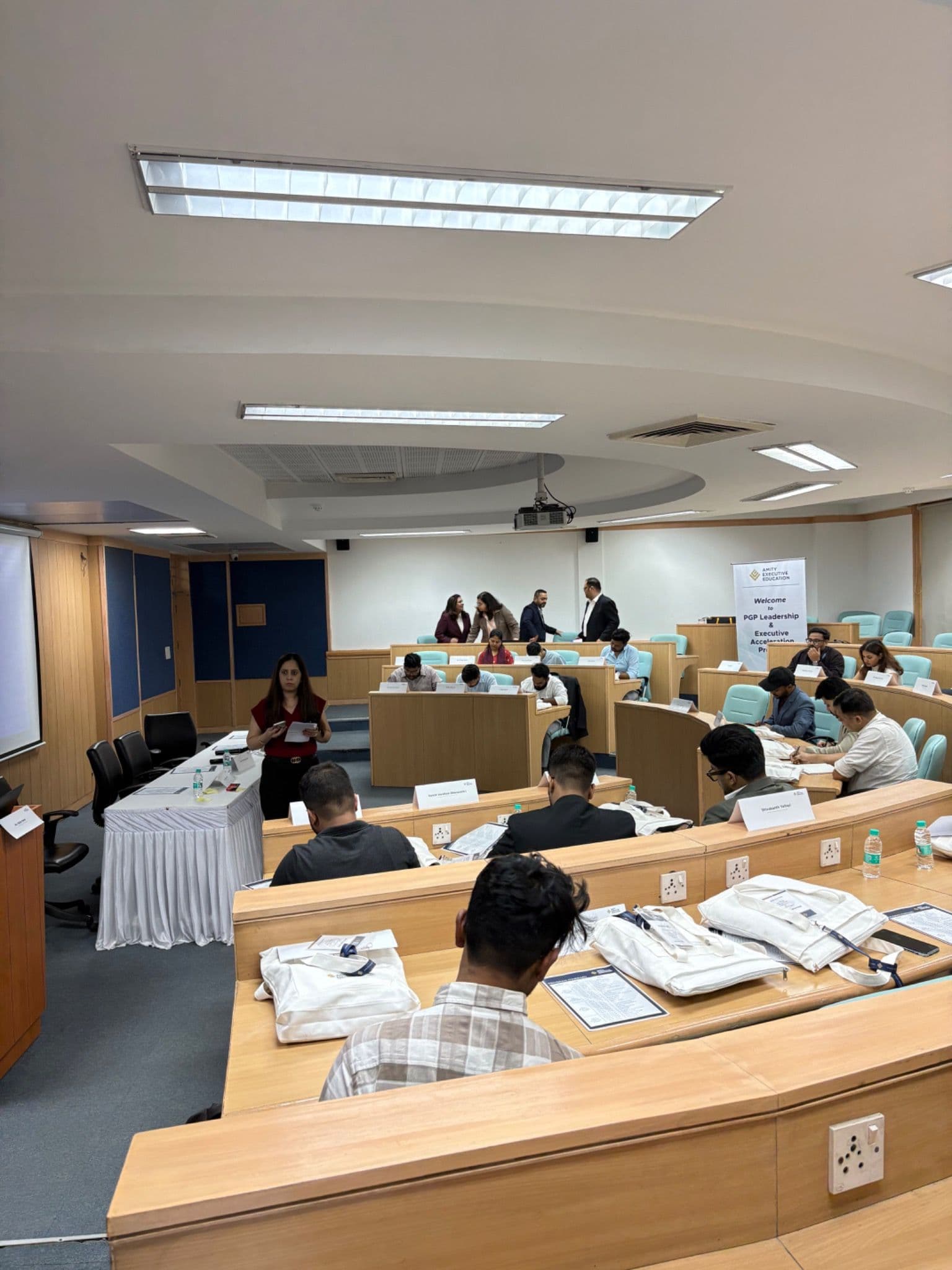 Participants working with programme materials during an AEE classroom session.